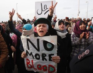 Protesters chant anti-government slogans as they demonstrate in a square in Benghazi city